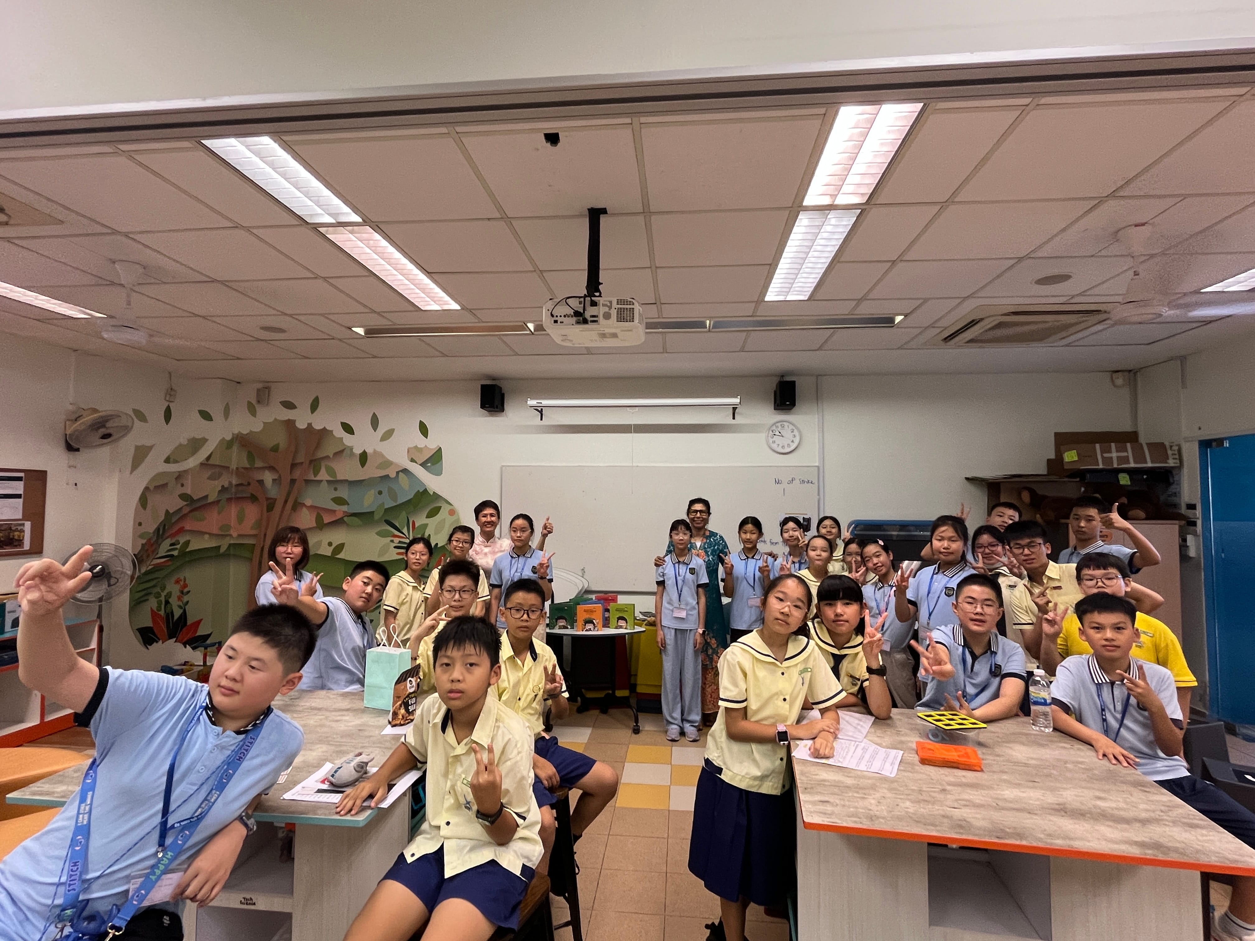 An enjoyable storytelling session with Ms Dolly as all the students pose together for a group photo